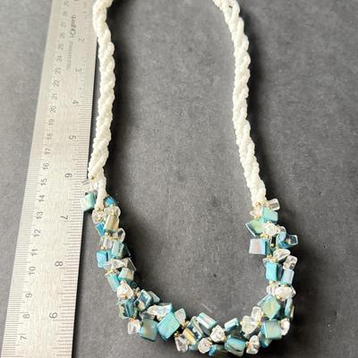 Vintage beaded necklace featuring irregular turquoise-colored shell chips necklace