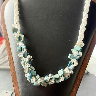 Vintage beaded necklace featuring irregular turquoise-colored shell chips necklace