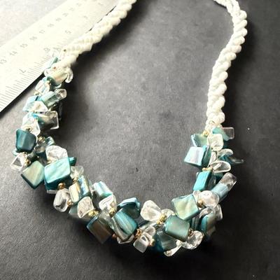 Vintage beaded necklace featuring irregular turquoise-colored shell chips necklace
