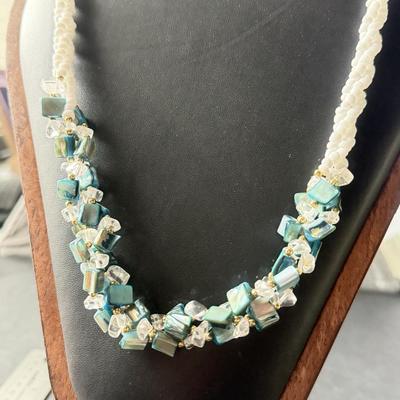 Vintage beaded necklace featuring irregular turquoise-colored shell chips necklace