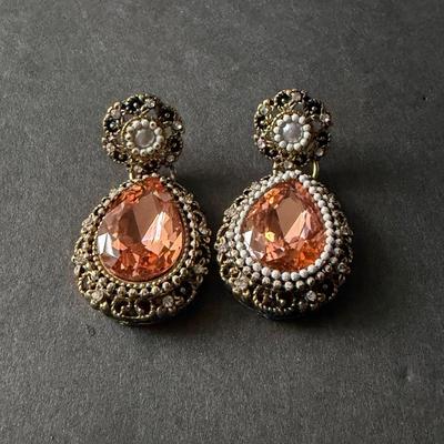 blush pink drop earrings with a vintage-style gold-tone finish.