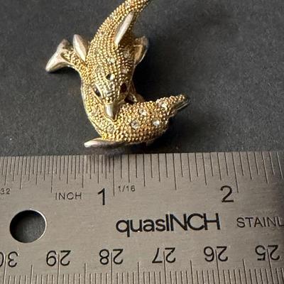 Gold tone sparkle rhinestone dolphin brooch