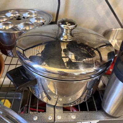 Sale Photo Thumbnail #23: Pots and Pans, cake pan, metal cups, electric knife and skillet.