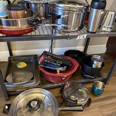 Sale Photo Thumbnail #18: Pots and Pans, cake pan, metal cups, electric knife and skillet.