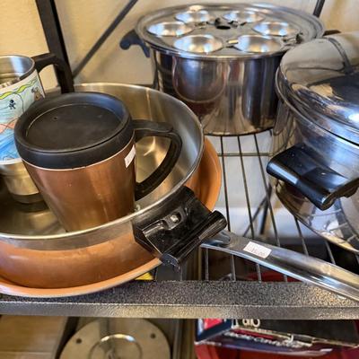Sale Photo Thumbnail #24: Pots and Pans, cake pan, metal cups, electric knife and skillet.