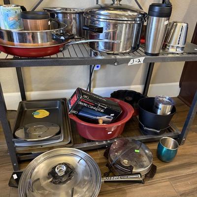 Sale Photo Thumbnail #17: Pots and Pans, cake pan, metal cups, electric knife and skillet.