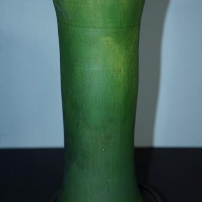 Sale Photo Thumbnail #174: a 12" vintaGE cyclinder form vase. matt green slip glaze with yellow color. 
The base is a yellow clay glazed. 
no markings found. 
Good condition. a few factory flaws along the top edge but these are not chips. 
Very classic looking piece.