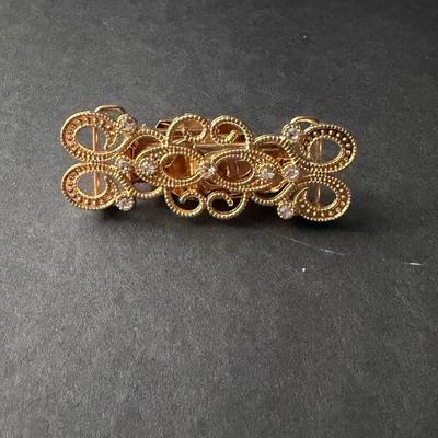 Fashion Sweden gold-tone metal swirly design rhinestone sweater or dress clip.