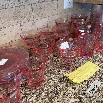 Sale Photo Thumbnail #40: Pink Fostoria  1966 
6 plates, 5 footed glasses, 5 glasses,
 5 small champagne glasses
