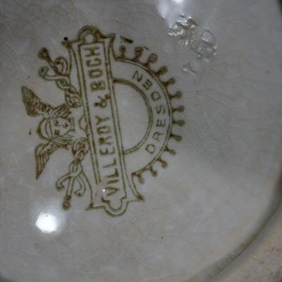 Sale Photo Thumbnail #184: Measures: 13" by 6 " 3"
Condition: there is crazing throughout the glaze. One small chip off the glaze in the interior. small. .
mostly a white color with the tan coloring from age and use. very unique. 
Marked on the back Villeroy and Boch hallmark Dresd