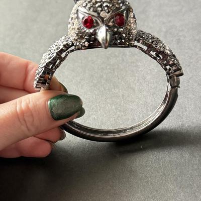 Silver tone rhinestone owl hinged bracelet with red ruby eyes
