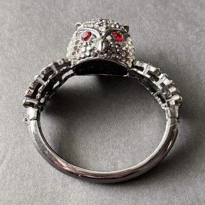 Silver tone rhinestone owl hinged bracelet with red ruby eyes
