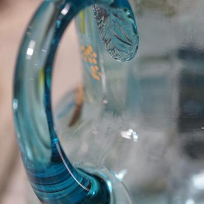 Sale Photo Thumbnail #190: This is a possible Northwood glass pitcher and four glasses from the 1890's-1900.
Beautiful blue glass with hand painted glasses and pitcher of exotic stylized flowers
brush gold colored leaves ( slight wear to a few of these) the enamelled dots accent. N