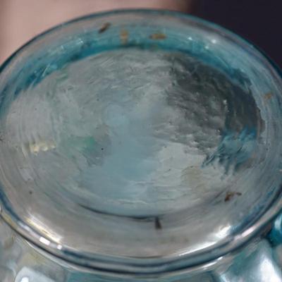 Sale Photo Thumbnail #189: This is a possible Northwood glass pitcher and four glasses from the 1890's-1900.
Beautiful blue glass with hand painted glasses and pitcher of exotic stylized flowers
brush gold colored leaves ( slight wear to a few of these) the enamelled dots accent. N