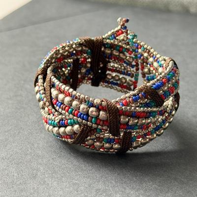 red and blue with silvertone beads criss-cross stretch cuff bracelet.