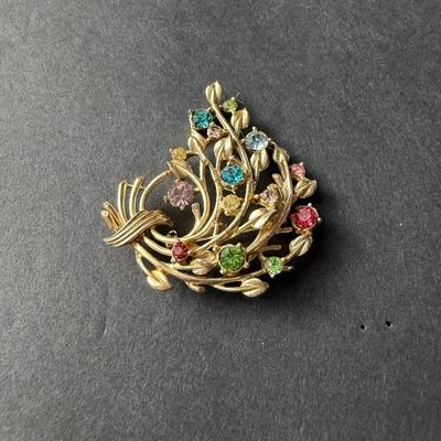 Vintage Coro vintage gold-tone and multicolor rhinestone floral bouquet brooch.