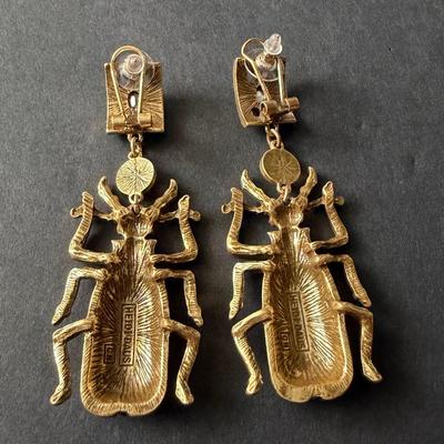 Heidi Daus blue beetle rhinestone statement earrings.