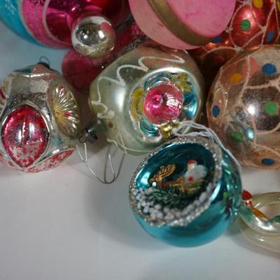 Sale Photo Thumbnail #208: Grouping of Christmas ornaments. 
the paint is off on some of them. They have signs of wear but still a good selection 
No breakage. Some may have the metal tops missing but overall interesting selection 
most are mercury blown and hand decorated.