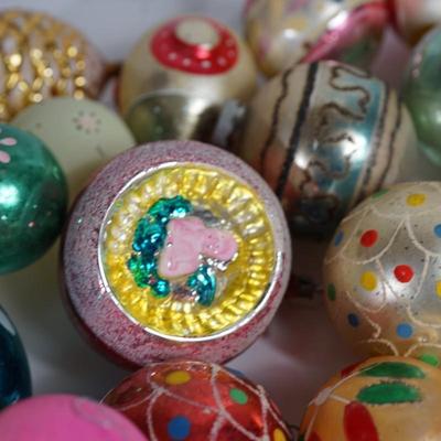 Sale Photo Thumbnail #206: Grouping of Christmas ornaments. 
the paint is off on some of them. They have signs of wear but still a good selection 
No breakage. Some may have the metal tops missing but overall interesting selection 
most are mercury blown and hand decorated.