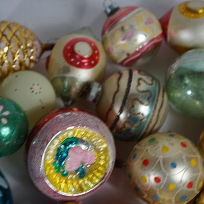 Sale Photo Thumbnail #210: Grouping of Christmas ornaments. 
the paint is off on some of them. They have signs of wear but still a good selection 
No breakage. Some may have the metal tops missing but overall interesting selection 
most are mercury blown and hand decorated.
