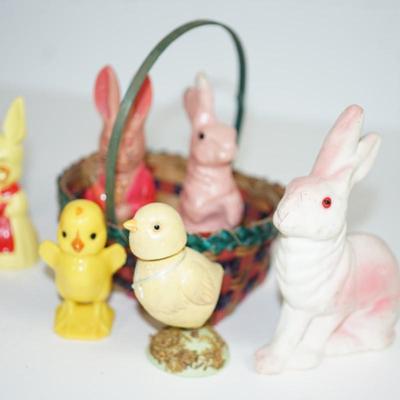 Sale Photo Thumbnail #217: grouping of plastic rabbits 6", 5" and 3" 
plastic little yellow chick at 3" 
two paper machine rabbits vintage 6" and 5"  -chips.   areas of missing paint. see photo 
the little basket is a vintage hand woven basket. measures about 7" in height good cond