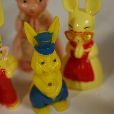 Sale Photo Thumbnail #221: grouping of plastic rabbits 6", 5" and 3" 
plastic little yellow chick at 3" 
two paper machine rabbits vintage 6" and 5"  -chips.   areas of missing paint. see photo 
the little basket is a vintage hand woven basket. measures about 7" in height good cond