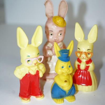Sale Photo Thumbnail #216: grouping of plastic rabbits 6", 5" and 3" 
plastic little yellow chick at 3" 
two paper machine rabbits vintage 6" and 5"  -chips.   areas of missing paint. see photo 
the little basket is a vintage hand woven basket. measures about 7" in height good cond