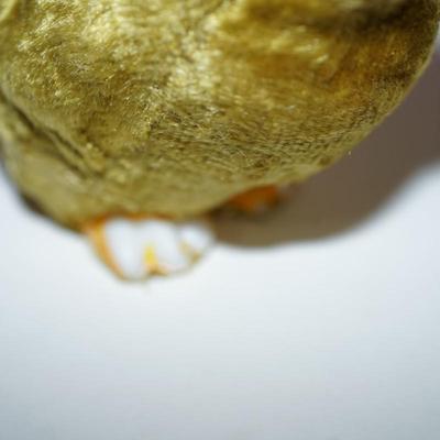 Sale Photo Thumbnail #235: three  chicks covered with a felt fabric , very soft, silk florals and ribbon . little black bead eyes.  and decorated with ribbon and other. The base is a hard white plastic. 
1940- 1950's? 
felt is missing on a few of the feet. two of the beaks have a l