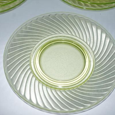 Sale Photo Thumbnail #246: possible Anchor Hocking Swirl pattern
8" 
vaseline glass 
set of eight
good condition. No cracks or chip. the glass is clear 
UV fluorescent