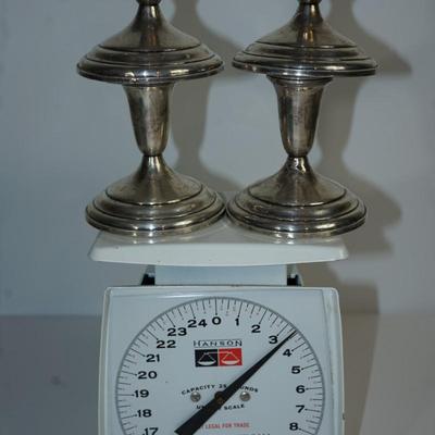 Sale Photo Thumbnail #248: at auction are two pairs of stamped sterling candlholders of 4"
one pair has dings and a few dents in the base, The other pair is in good condition
See scale for total weight . The basket is about 2.1 ounces. 
The 4" sterling weighted candleholders have a