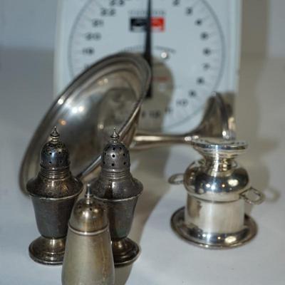 Sale Photo Thumbnail #250: sterling compote weighted/ the bowl is dented and bent to the stem 
pair of sterling salt and pepper shakers ( marked reenforced on the base) 3  3/4" with the finial, few dents on base 
one single sterling salt and pepper shaker( pure sterling not weighte