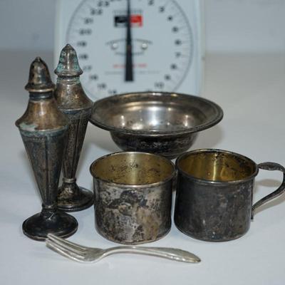 Sale Photo Thumbnail #253: 2 1/2"  sterling reenforced compote . nice condition but needs polishing 
5 1/2" sterling weighted salt and pepper shakers - art deco hammered finish. needs polishing in good condition 
2" sterling baby cup missing handle 
2" sterling baby cup with handle