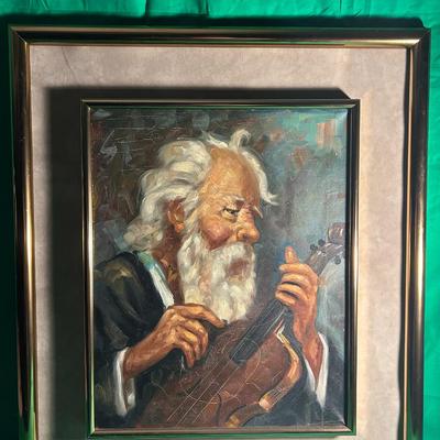 Sale Photo Thumbnail #6: Framed oil painting depicting an elderly man with white hair and a beard passionately playing a string instrument. The artwork is enclosed in a double mat with a gold-tone frame. The condition of the painting and frame appears to be well-maintained, with 