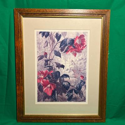 Sale Photo Thumbnail #64: A framed floral print featuring vibrant red and pink flowers with green leaves. The artwork is set within a double mat and enclosed in a wooden frame with a golden inner accent. The frame shows minimal wear and measures approximately 16 x 20 inches. Suita