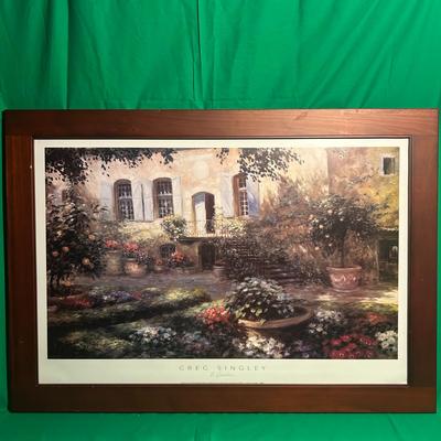 Sale Photo Thumbnail #108: Framed landscape print depicting a sunlit courtyard with flowers and potted plants. The composition portrays a serene outdoor setting with windows and stone walls in the background. The wooden frame has a deep brown finish, complementing the artwork. Over