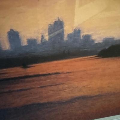 Sale Photo Thumbnail #246: Beautiful colors of the skyline framed in a silver frame measuring 37” x 31.5”. Some damage on frame.