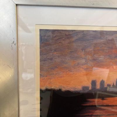 Sale Photo Thumbnail #245: Beautiful colors of the skyline framed in a silver frame measuring 37” x 31.5”. Some damage on frame.