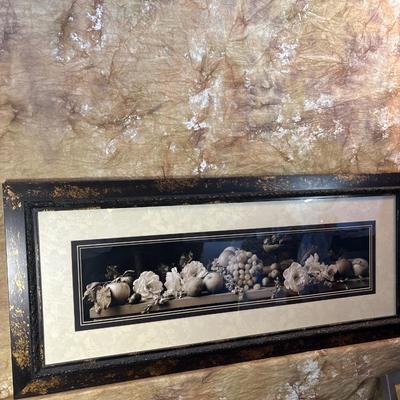 Sale Photo Thumbnail #274: Beautiful rectangle frame measuring 42.5“ x 19“. Art displays floral and fruit. with dark background and light features.