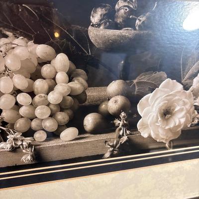 Sale Photo Thumbnail #276: Beautiful rectangle frame measuring 42.5“ x 19“. Art displays floral and fruit. with dark background and light features.