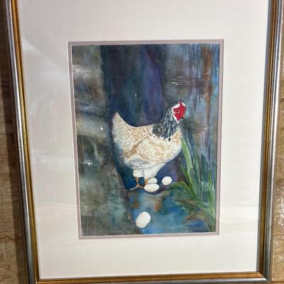Sale Photo Thumbnail #413: Appears to be watercolor beautifully framed. A hen with several eggs, double matted. Frame measures 20” x 24”.