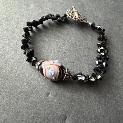 handmade glass and black beaded bracelet with a toggle clasp.