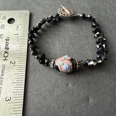 handmade glass and black beaded bracelet with a toggle clasp.