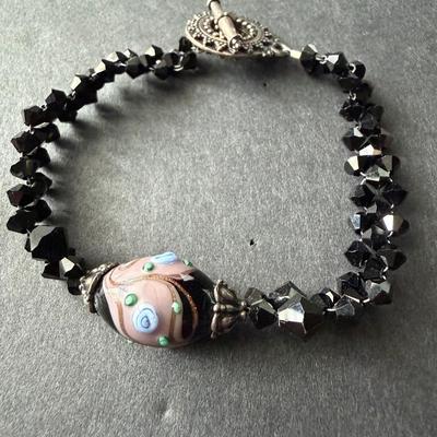 handmade glass and black beaded bracelet with a toggle clasp.