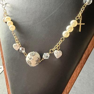 Gold tone heart and cross charms fashion necklace