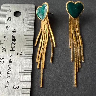 Gold tone dangle earrings with green hearts