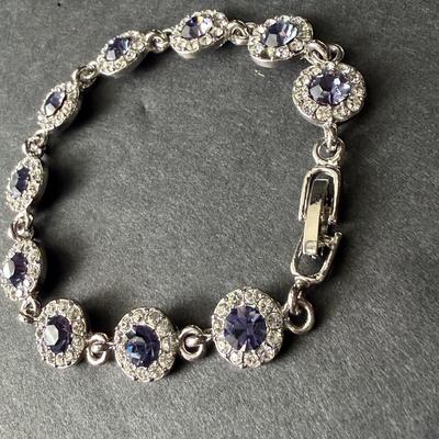 Purple gemstone silver tone rhinestone tennis bracelet