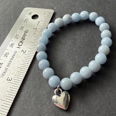 OLGASGEMS aquamarine beaded stretch bracelet with a heart charm.