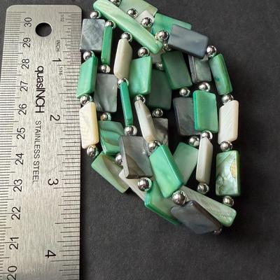 Multi strand green rectangular and white shell type bracelet