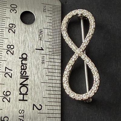 Silver tone rhinestone infinity pin vintage