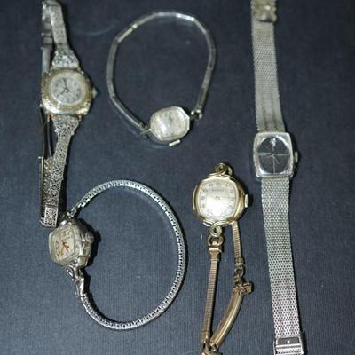 Sale Photo Thumbnail #293: Group of ladies wrist watches. Not working , 
One in 10 kt gold filled case, others are stainless steel or not marked, 
parts or repair